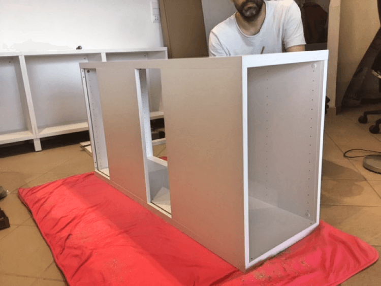 placing the top panel on the behind the couch cabinet